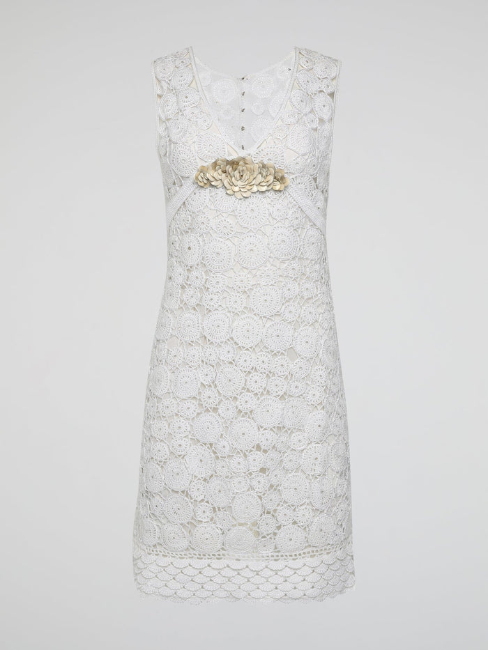 Step into the world of exquisite elegance with this captivating White Crochet Dress by Roberto Cavalli. Crafted with meticulous attention to detail, this dress channels the essence of femininity, showcasing delicate crochet patterns that gracefully embrace your silhouette. Whether you're attending a garden soiree or a beachfront dinner, this dress effortlessly combines timeless charm with modern flair, making you the epitome of effortless beauty.