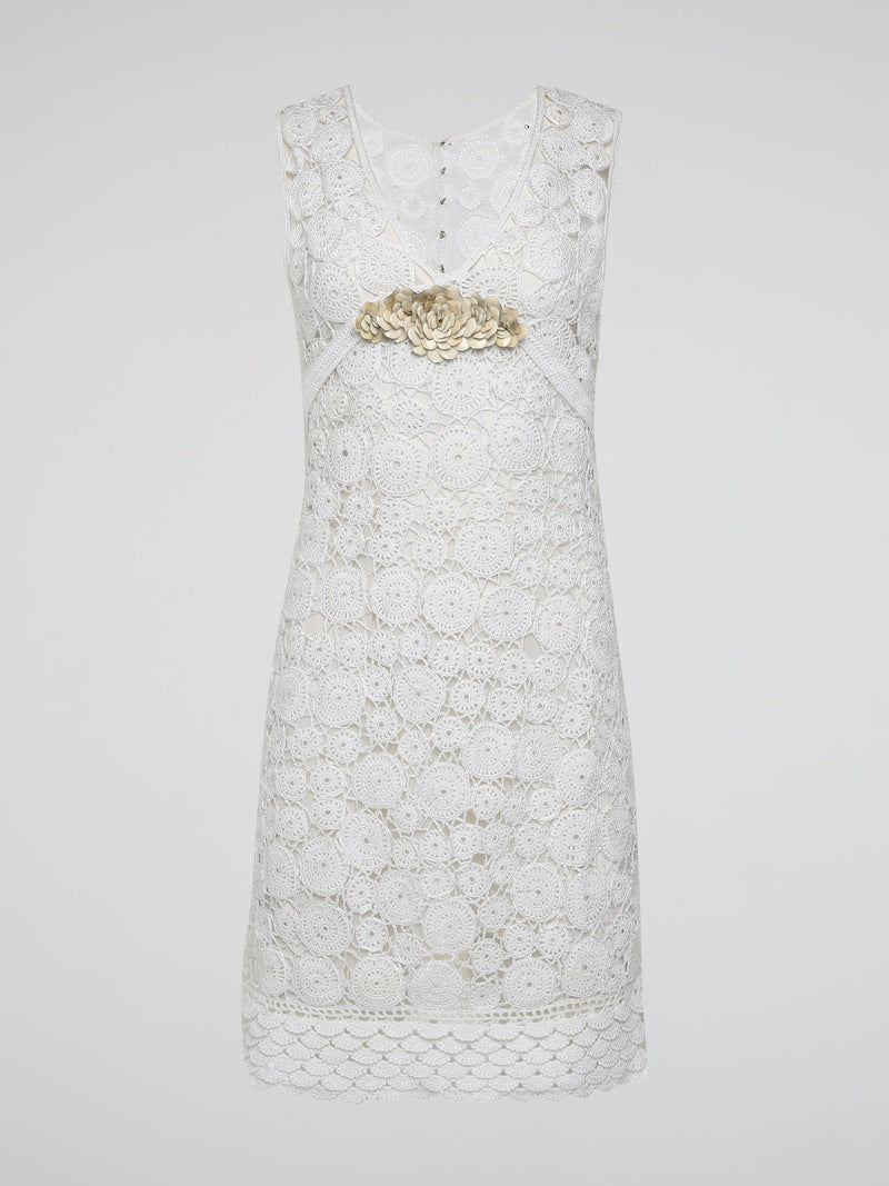 Step into the world of exquisite elegance with this captivating White Crochet Dress by Roberto Cavalli. Crafted with meticulous attention to detail, this dress channels the essence of femininity, showcasing delicate crochet patterns that gracefully embrace your silhouette. Whether you're attending a garden soiree or a beachfront dinner, this dress effortlessly combines timeless charm with modern flair, making you the epitome of effortless beauty.