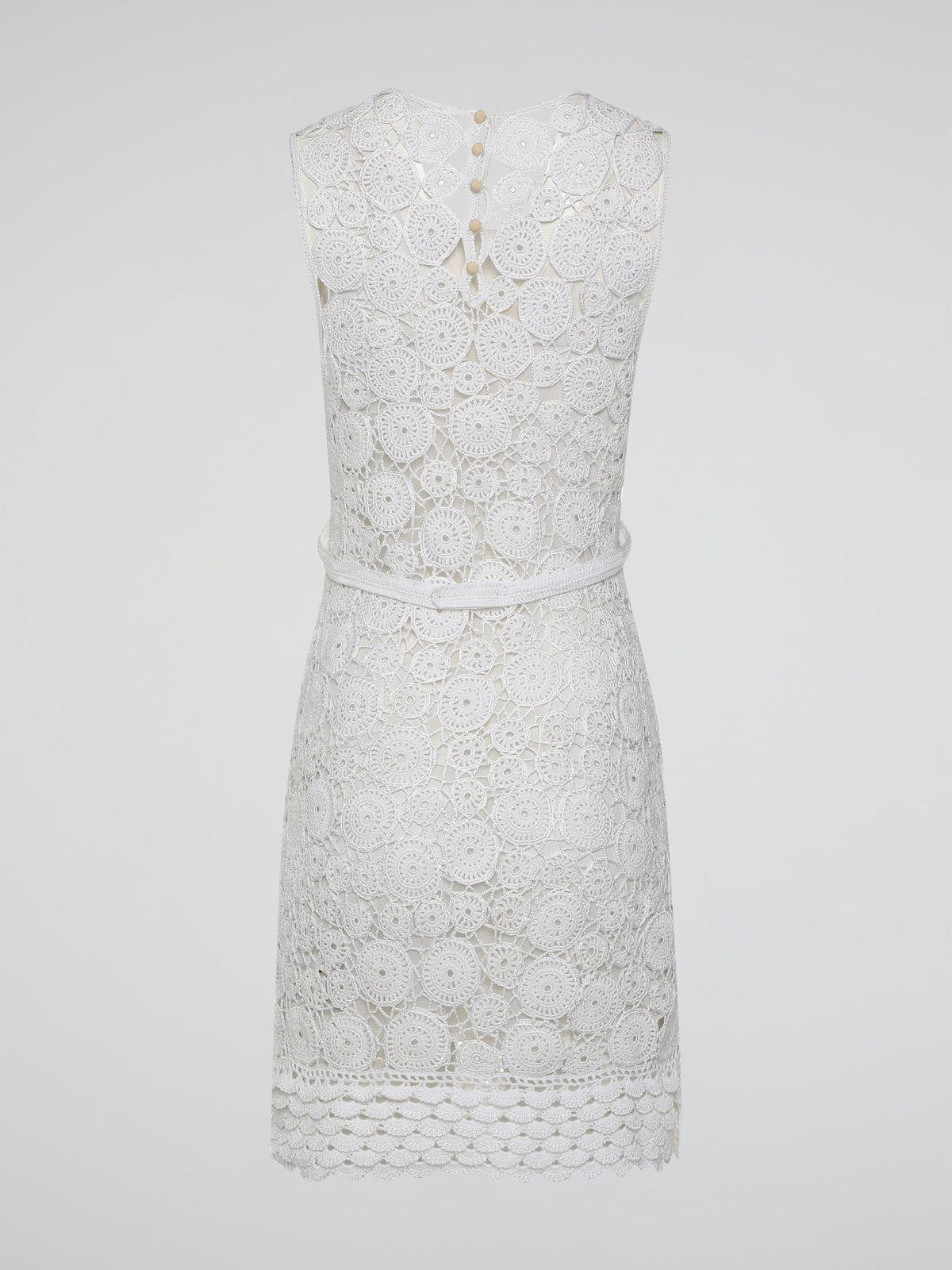 Step into the world of exquisite elegance with this captivating White Crochet Dress by Roberto Cavalli. Crafted with meticulous attention to detail, this dress channels the essence of femininity, showcasing delicate crochet patterns that gracefully embrace your silhouette. Whether you're attending a garden soiree or a beachfront dinner, this dress effortlessly combines timeless charm with modern flair, making you the epitome of effortless beauty.