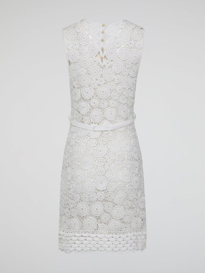 Step into the world of exquisite elegance with this captivating White Crochet Dress by Roberto Cavalli. Crafted with meticulous attention to detail, this dress channels the essence of femininity, showcasing delicate crochet patterns that gracefully embrace your silhouette. Whether you're attending a garden soiree or a beachfront dinner, this dress effortlessly combines timeless charm with modern flair, making you the epitome of effortless beauty.