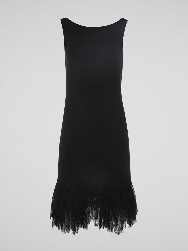 Introducing the epitome of elegance and glamour ��� the Black Fringe Hem Dress by Roberto Cavalli. This show-stopping piece combines the timeless sophistication of a little black dress with the playful flair of fringed details. With its figure-hugging silhouette and exquisite craftsmanship, this dress is a must-have for those seeking to make a lasting impression at any occasion.