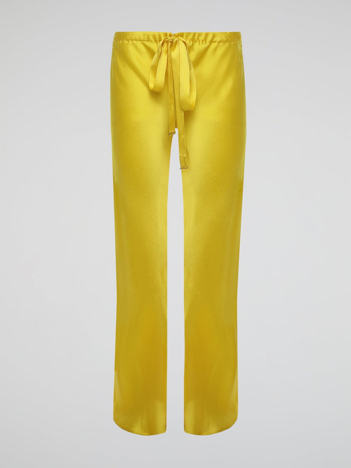 Step up your style game with these vibrant Yellow Drawstring Silk Trousers by Roberto Cavalli. Crafted from luxurious silk, these statement trousers offer a silky soft touch and a flowing silhouette that is both elegant and comfortable. Perfect for any occasion, let these eye-catching pants be the star of your ensemble.