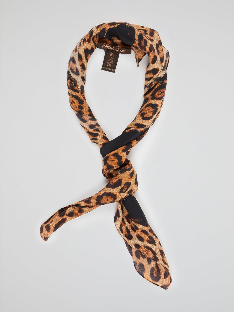 Wrap yourself in fierce style with the Animal Print Statement Scarf by Roberto Cavalli. This captivating accessory is a daring blend of elegance and untamed spirit, featuring a bold animal print pattern that demands attention. Crafted from luxurious materials, this scarf is a must-have for those who dare to make a fashion statement wherever they go.