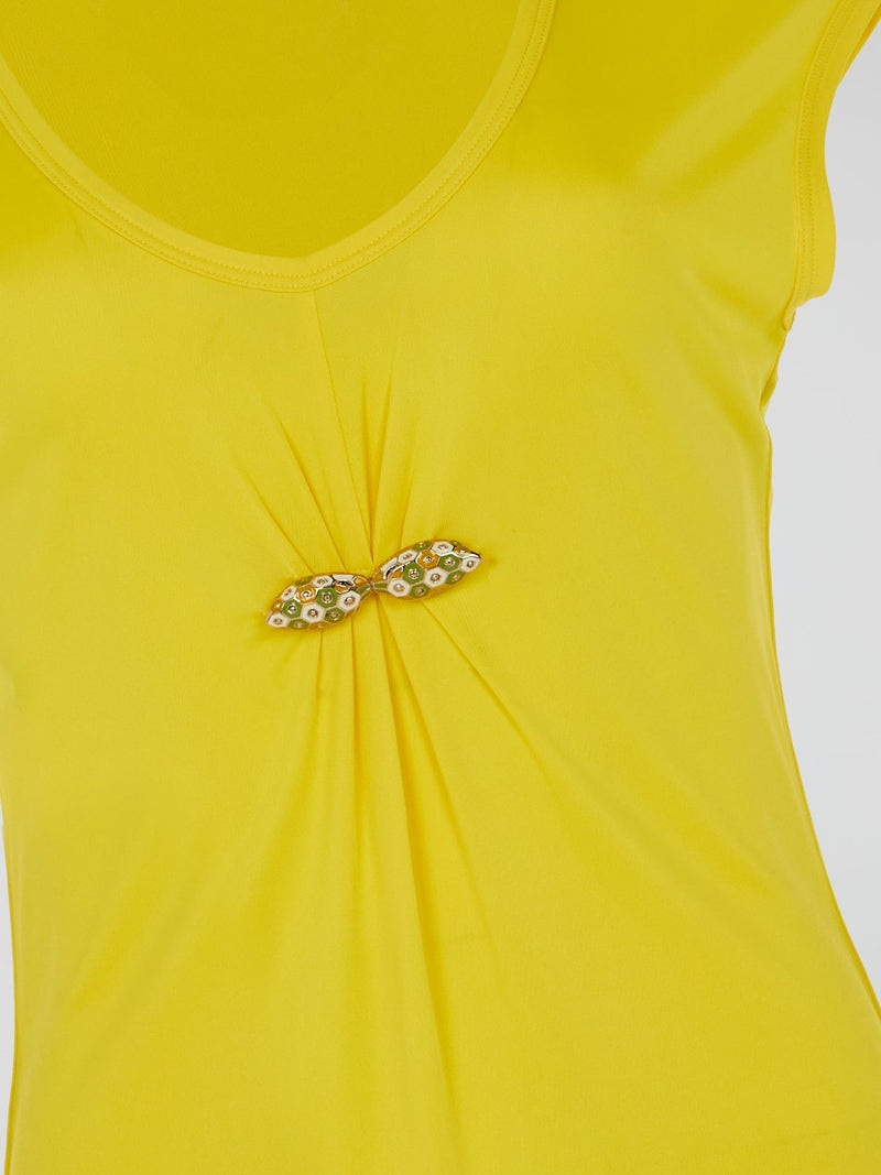 Make a bold statement with the Yellow Cap Sleeve Top by Roberto Cavalli, where vibrant sunshine meets high fashion finesse. Crafted with premium quality and attention to detail, its cap sleeves add a touch of playful elegance to any outfit. Embrace your inner fashion icon as you confidently step out, turning heads and radiating pure glamour.