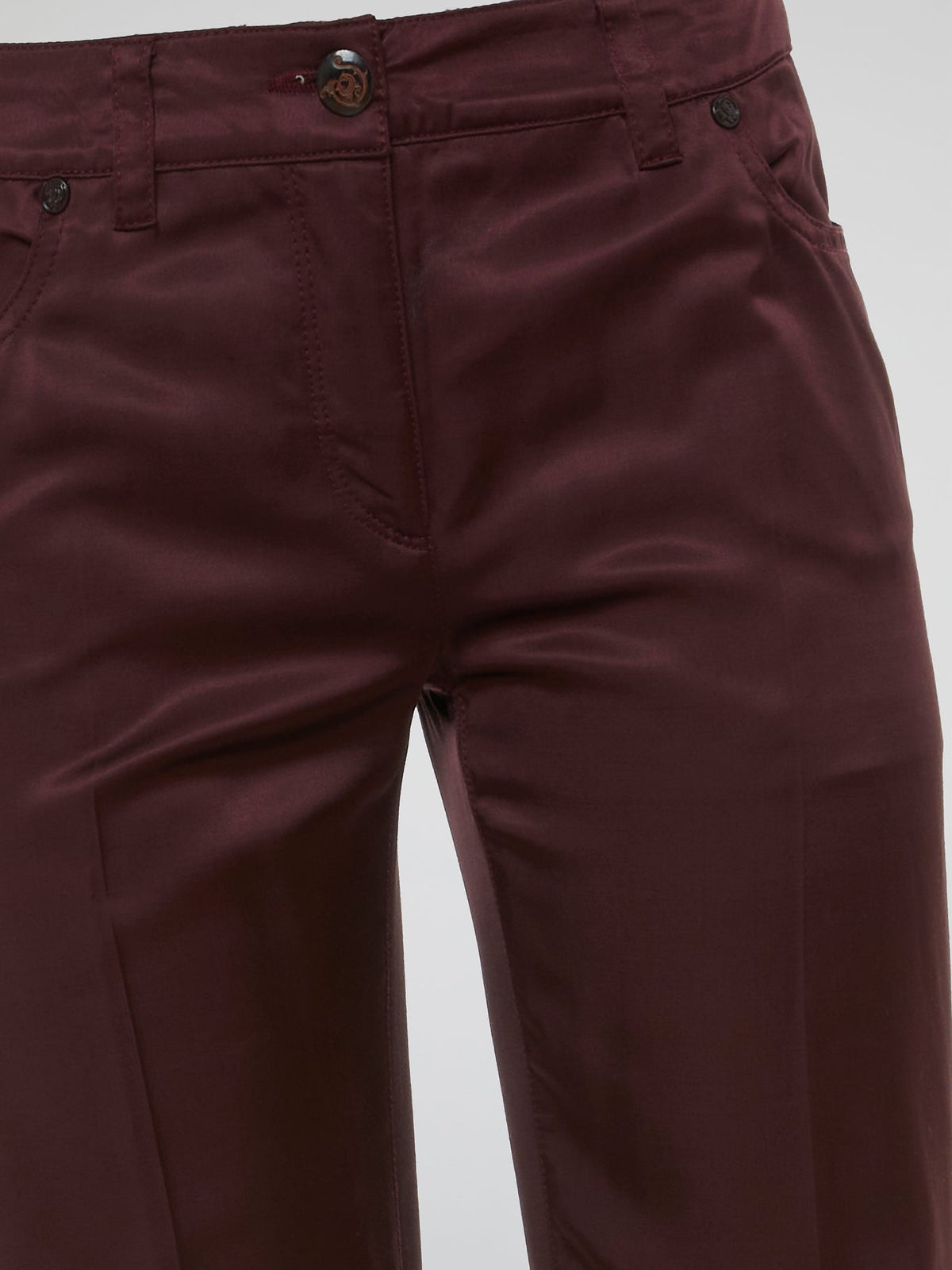 Step up your fashion game with these Burgundy Flared Pants by Clas Roberto Cavalli. Crafted from luxurious materials, these pants offer a sleek and chic silhouette with a touch of retro flair. Perfect for both formal and casual occasions, they effortlessly elevate any outfit, making you the style icon wherever you go.