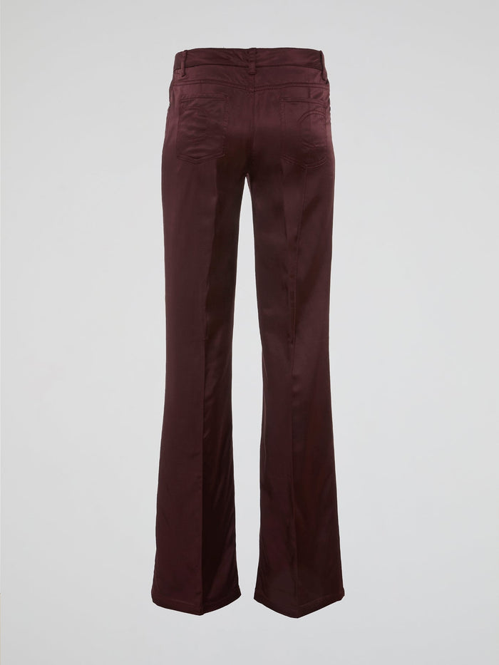 Step up your fashion game with these Burgundy Flared Pants by Clas Roberto Cavalli. Crafted from luxurious materials, these pants offer a sleek and chic silhouette with a touch of retro flair. Perfect for both formal and casual occasions, they effortlessly elevate any outfit, making you the style icon wherever you go.