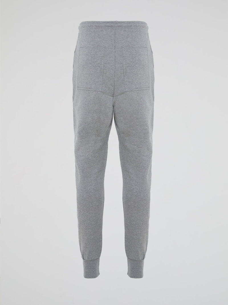 Introducing the Grey Zipper Detailed Sweatpants designed by the visionary fashion guru Markus Lupfer. These sweatpants are the epitome of comfort with a luxurious twist. With their unique zipper detailing, they effortlessly merge style and functionality, making them the ideal companion for both lounging at home and making a bold fashion statement on the streets.