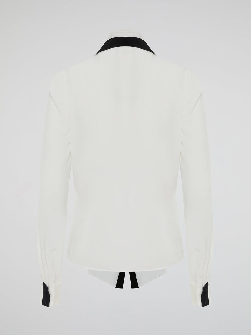 Introducing the White Contract Detailed Shirt by Emanuel Ungaro - a symphony of sophistication and style. Crafted with meticulous attention to detail, this shirt embodies elegance with its intricate contract stitching, adding a touch of modernity to a classic design. Perfect for the discerning gentleman who seeks to make a bold and refined statement, this shirt is the epitome of luxury fashion.