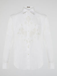 Step into a realm of elegance with the White Embroidered Shirt by Roberto Cavalli, where classic sophistication meets modern charm. Crafted with meticulous attention to detail, this shirt showcases exquisite floral embroidery that dances gracefully across the pristine white fabric. Embrace your inner fashion icon as you effortlessly blend timeless style with a touch of Italian flair, making a statement that is as timeless as it is enchanting.