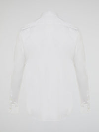 Step into a realm of elegance with the White Embroidered Shirt by Roberto Cavalli, where classic sophistication meets modern charm. Crafted with meticulous attention to detail, this shirt showcases exquisite floral embroidery that dances gracefully across the pristine white fabric. Embrace your inner fashion icon as you effortlessly blend timeless style with a touch of Italian flair, making a statement that is as timeless as it is enchanting.