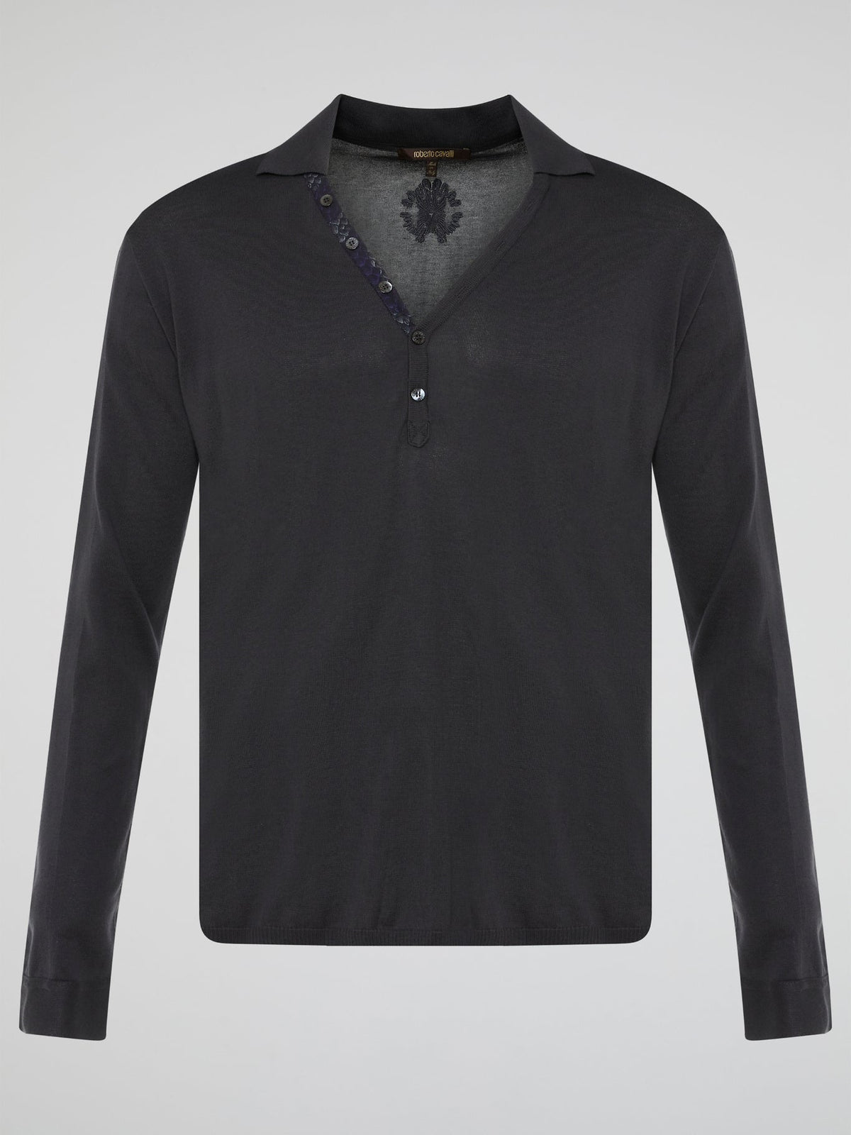 Elevate your style with the timeless elegance of our Black Long Sleeve Polo Shirt by Roberto Cavalli. Crafted with meticulous attention to detail, this wardrobe staple features a luxurious blend of comfort and sophistication. Whether you're headed to a casual brunch or a formal event, this Polo Shirt will effortlessly take you from day to night with its sleek design and iconic Cavalli logo.