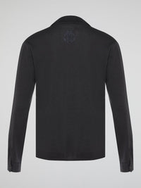 Elevate your style with the timeless elegance of our Black Long Sleeve Polo Shirt by Roberto Cavalli. Crafted with meticulous attention to detail, this wardrobe staple features a luxurious blend of comfort and sophistication. Whether you're headed to a casual brunch or a formal event, this Polo Shirt will effortlessly take you from day to night with its sleek design and iconic Cavalli logo.