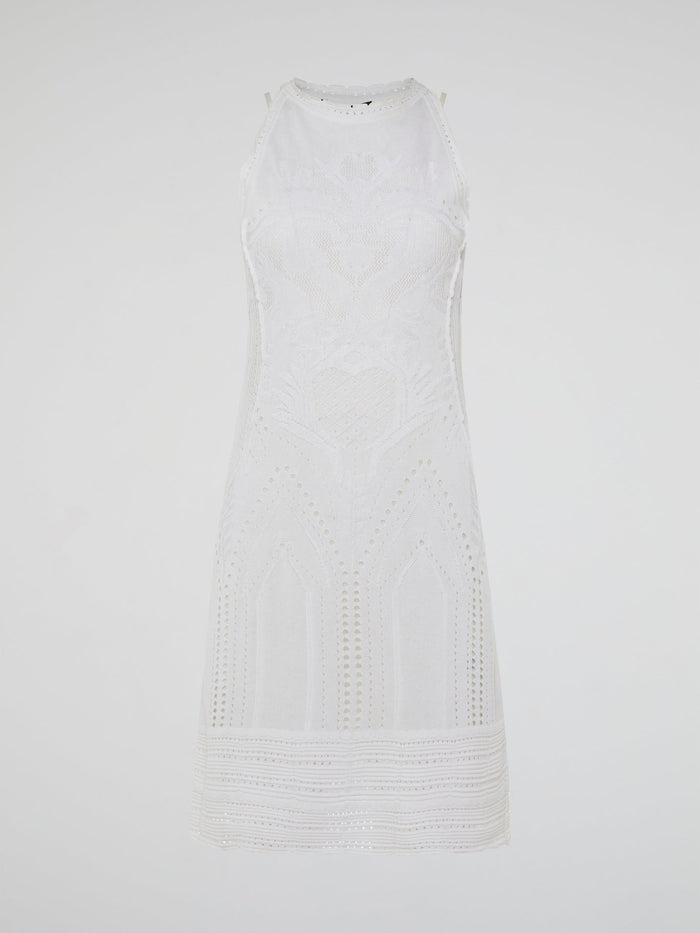 Dance into shimmering moonlit nights in the ethereal beauty of the White Knitted Sleeveless Dress by Roberto Cavalli. Crafted with meticulous artistry, this exquisite dress features delicate knitted patterns that seamlessly cascade down your curves, creating an enchanting silhouette. With its timeless elegance and romantic charm, this dress is a masterpiece that exudes pure grace and allure.