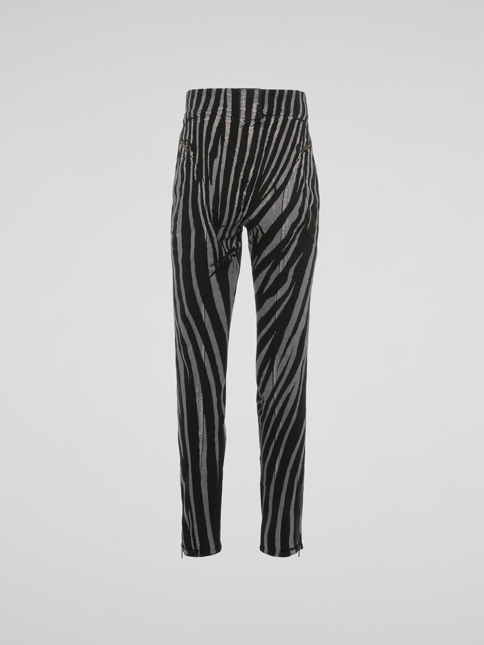 Unleash your wild side with these Zebra Print High Waist Trousers by Roberto Cavalli. Crafted with impeccable precision, these trousers effortlessly blend elegance with an untamed touch. Perfect for those who dare to stand out, channel your inner fashionista and let the world be your runway in these fierce and fabulous statement trousers.