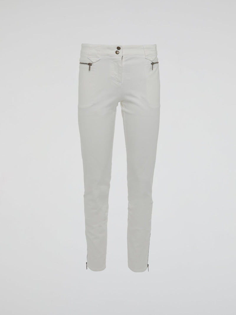 Introducing the epitome of style and sophistication - the White Zipper Detailed Trousers by Roberto Cavalli. These exquisite trousers blend modern minimalism with edgy details, boasting a sleek white hue that exudes elegance. The alluring zipper accents strategically placed throughout add a touch of rebellious charm, making these trousers a true fashion statement.