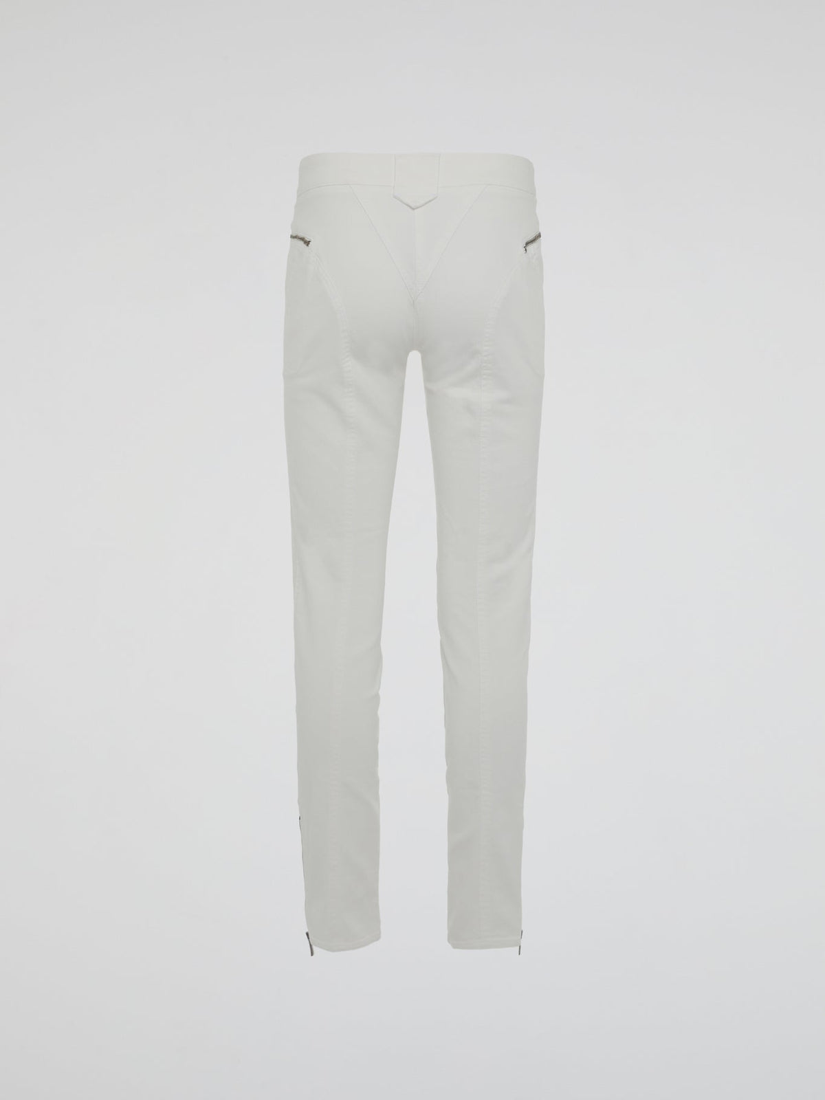 Introducing the epitome of style and sophistication - the White Zipper Detailed Trousers by Roberto Cavalli. These exquisite trousers blend modern minimalism with edgy details, boasting a sleek white hue that exudes elegance. The alluring zipper accents strategically placed throughout add a touch of rebellious charm, making these trousers a true fashion statement.