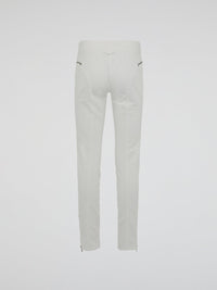 Introducing the epitome of style and sophistication - the White Zipper Detailed Trousers by Roberto Cavalli. These exquisite trousers blend modern minimalism with edgy details, boasting a sleek white hue that exudes elegance. The alluring zipper accents strategically placed throughout add a touch of rebellious charm, making these trousers a true fashion statement.