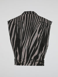 Step into the wild side of fashion with the mesmerizing Zebra Print Sleeveless Jacket by Roberto Cavalli. This avant-garde masterpiece effortlessly combines the untamed spirit of zebras with the sophistication of Italian craftsmanship. With its bold monochromatic stripes and impeccable tailoring, this statement piece will make heads turn and hearts skip a beat wherever you go.