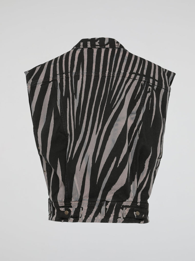 Step into the wild side of fashion with the mesmerizing Zebra Print Sleeveless Jacket by Roberto Cavalli. This avant-garde masterpiece effortlessly combines the untamed spirit of zebras with the sophistication of Italian craftsmanship. With its bold monochromatic stripes and impeccable tailoring, this statement piece will make heads turn and hearts skip a beat wherever you go.