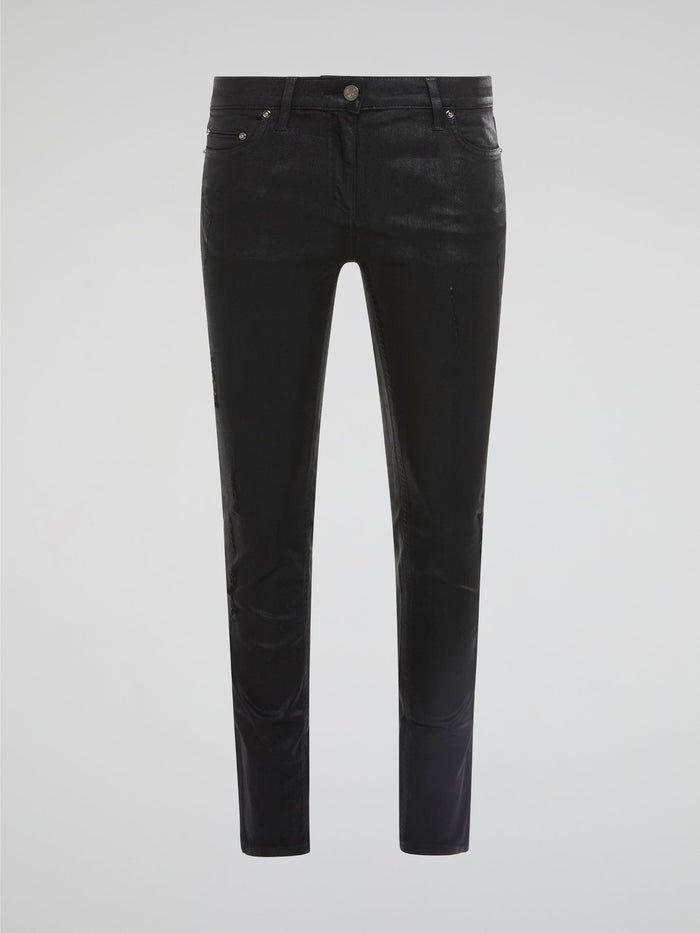 Step into edgy sophistication with Roberto Cavalli's Black Distressed Skinny Jeans. These sleek denim bottoms feature a subtle worn-in look with distressed detailing for a modern twist on a classic style. Elevate your outfit with these statement-making jeans that exude cool confidence and undeniable luxury.