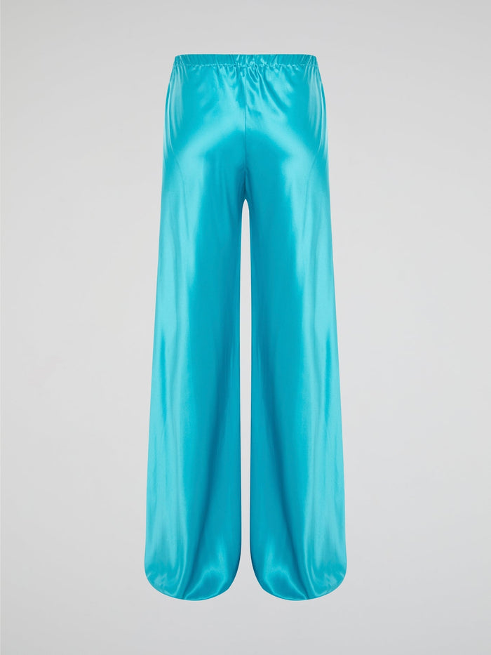 Step up your style game with these luxurious blue silk pants by Roberto Cavalli. The drawstring waist adds a casual and comfortable touch to the elegant silk fabric, making them perfect for any occasion. Stand out from the crowd and make a statement with these unique and eye-catching pants.