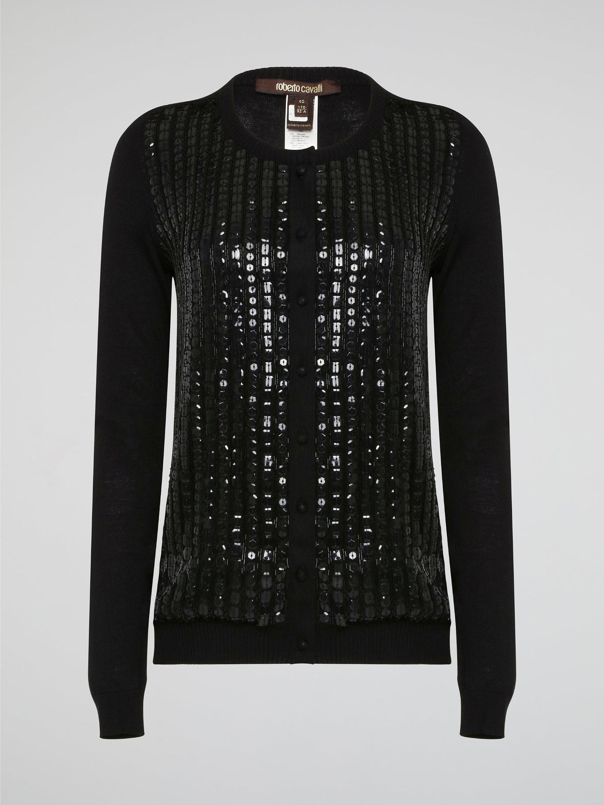 Wrap yourself in luxurious style with this Black Embroidered Cardigan from Roberto Cavalli. Featuring intricate embossed detailing that adds a touch of glamour to any outfit, this cardigan is perfect for layering in the cooler months. Elevate your wardrobe with this statement piece that is sure to turn heads wherever you go.