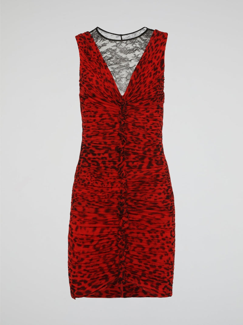 Make a fierce statement with this red leopard print ruched dress from Roberto Cavalli. The bold animal print pattern combined with the flattering ruched detailing creates a stunning and eye-catching look. Perfect for a night out or special event, this dress will make you stand out from the crowd in style.