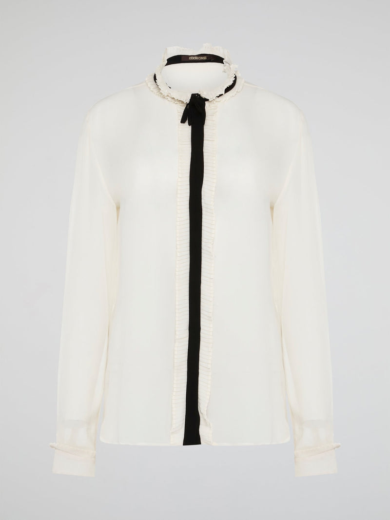 Step into luxury and sophistication with the Roberto Cavalli White Frill Detailed Blouse. The delicate frill detailing adds a touch of elegance to this classic white blouse, making it a perfect choice for any special occasion. Elevate your wardrobe with this timeless piece that exudes high-end fashion and style.