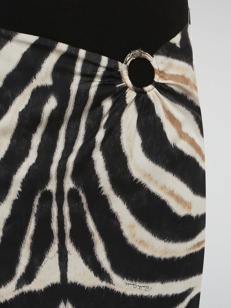 Unleash your wild side with this stunning Animal Print Pencil Skirt by Roberto Cavalli. Crafted with luxurious materials and a flawless silhouette, this skirt will make you feel fierce and fabulous. Whether you're in the office or hitting the town, this statement piece is sure to turn heads wherever you go.