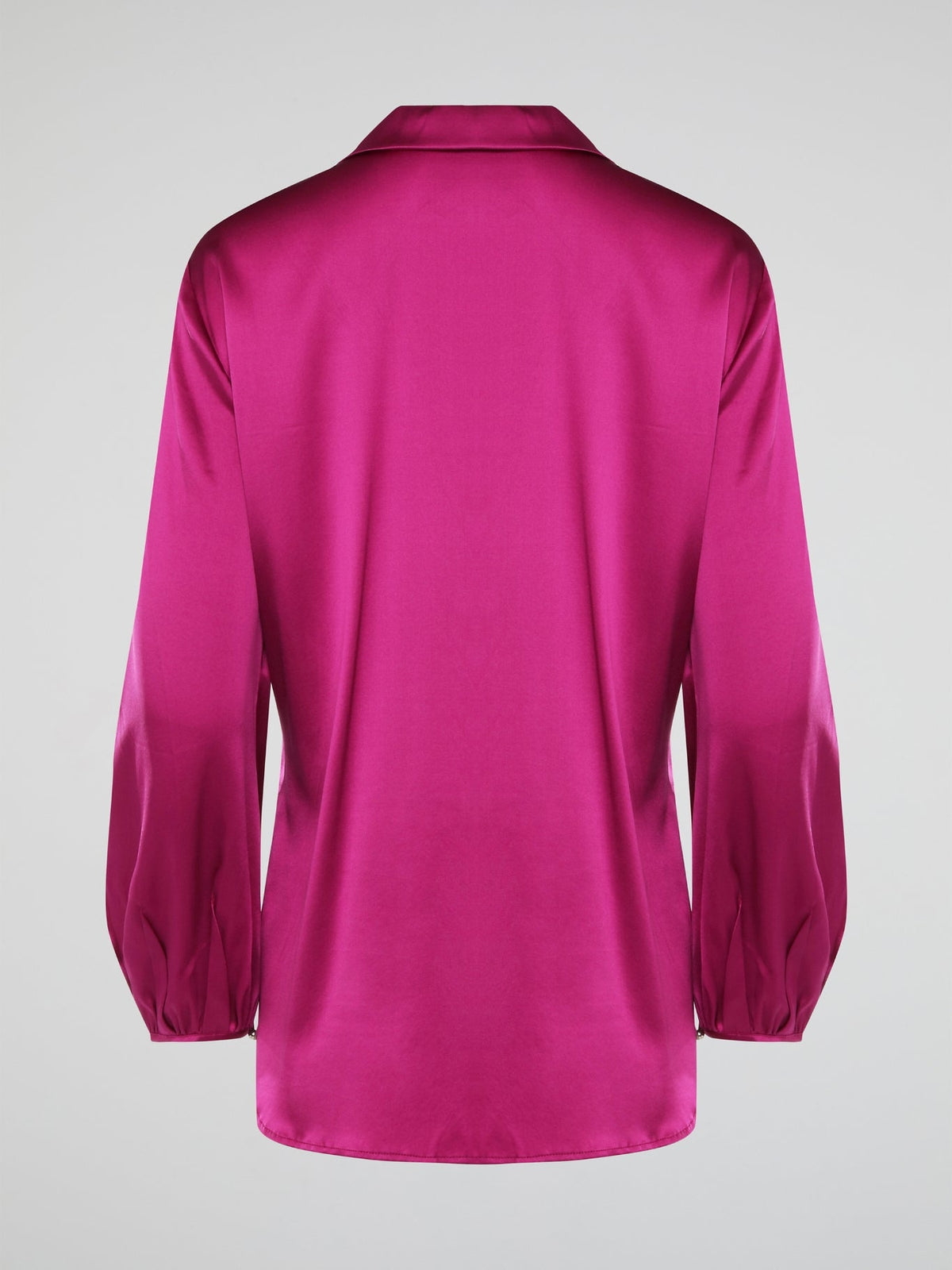 Elevate your wardrobe with this exquisite Pink Long Sleeve Silk Shirt by Roberto Cavalli. Crafted from luxurious silk fabric, this shirt drapes beautifully on the body, creating a sophisticated silhouette. The vibrant pink hue adds a pop of color to any outfit, making it the perfect statement piece for any occasion.