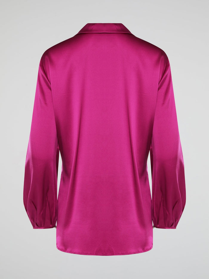 Elevate your wardrobe with this exquisite Pink Long Sleeve Silk Shirt by Roberto Cavalli. Crafted from luxurious silk fabric, this shirt drapes beautifully on the body, creating a sophisticated silhouette. The vibrant pink hue adds a pop of color to any outfit, making it the perfect statement piece for any occasion.