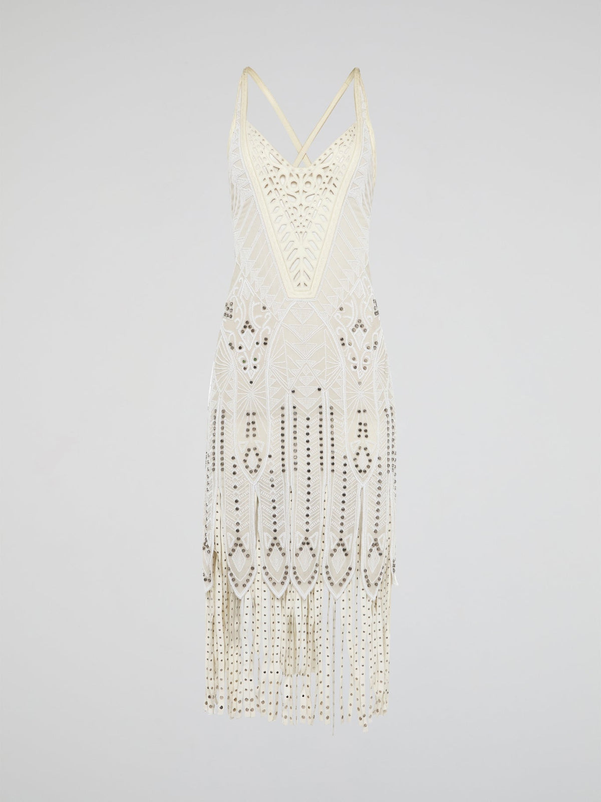 Step out in style in this stunning White Embroidered Fringe Dress from iconic designer Roberto Cavalli. The intricate embroidery detailing and playful fringe trim add a touch of bohemian elegance to this timeless piece. Whether you're hitting the beach or attending a summer soir��e, this dress is sure to turn heads and make a statement.