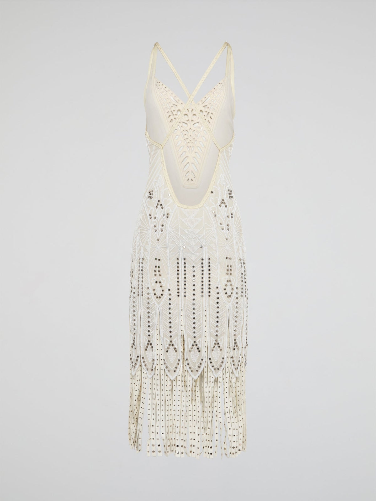 Step out in style in this stunning White Embroidered Fringe Dress from iconic designer Roberto Cavalli. The intricate embroidery detailing and playful fringe trim add a touch of bohemian elegance to this timeless piece. Whether you're hitting the beach or attending a summer soir��e, this dress is sure to turn heads and make a statement.