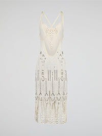 Step out in style in this stunning White Embroidered Fringe Dress from iconic designer Roberto Cavalli. The intricate embroidery detailing and playful fringe trim add a touch of bohemian elegance to this timeless piece. Whether you're hitting the beach or attending a summer soir��e, this dress is sure to turn heads and make a statement.