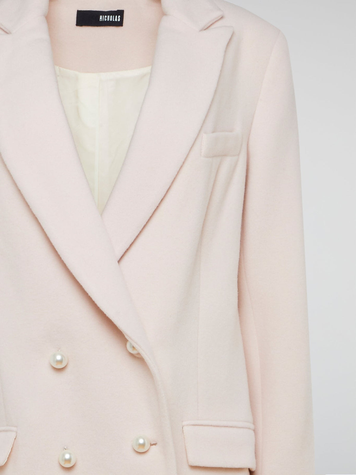 Step out in style with the Powder Pink Trench Coat Nicholas, a chic and sophisticated piece that will elevate any outfit. Its flattering fit and soft pastel hue make it the perfect statement piece for any fashion-forward individual. Be prepared for compliments wherever you go with this stunning wardrobe staple.