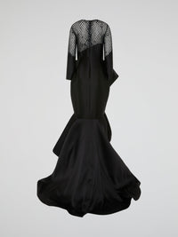 Make a statement in this stunning Black Mesh Bodice Mermaid Gown by Isabel Sanchis. The intricate mesh detailing on the bodice adds a touch of elegance, while the mermaid silhouette hugs your curves in all the right places. Perfect for a formal event or a red carpet soir��e, this gown is sure to turn heads and make you feel like a true Hollywood star.