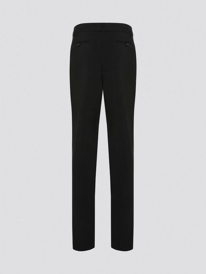 Step up your style game with these chic Black Belted Pleated Trousers by Roberto Cavalli, designed to make a statement. The flattering pleats and elegant belt detailing give these trousers a sophisticated edge, perfect for any fashion-forward individual. Whether worn to the office or a night out on the town, these trousers are sure to turn heads and leave a lasting impression.