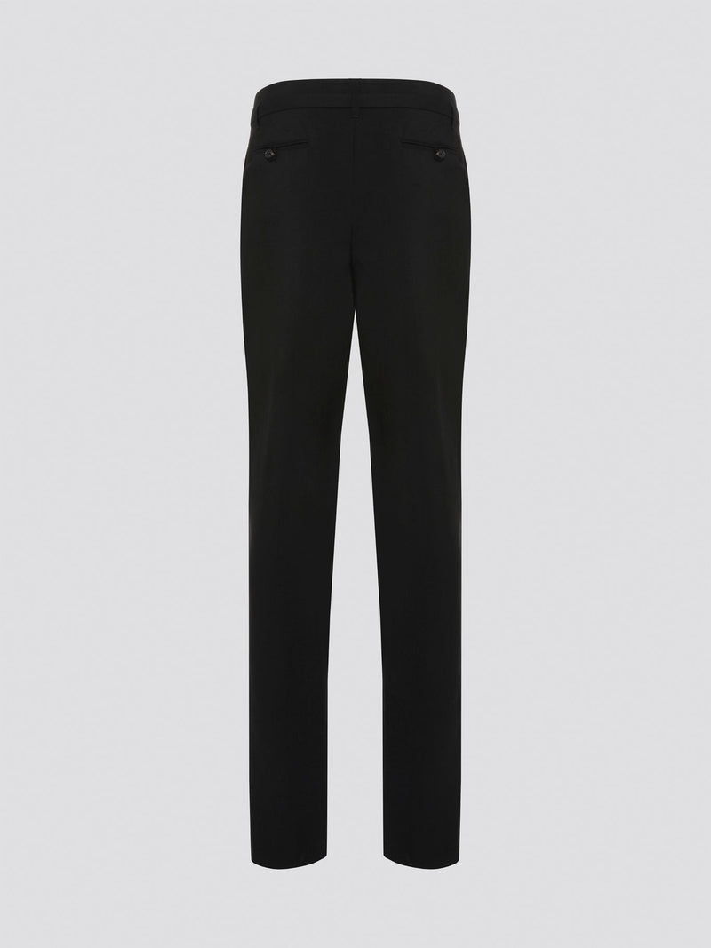 Step up your style game with these chic Black Belted Pleated Trousers by Roberto Cavalli, designed to make a statement. The flattering pleats and elegant belt detailing give these trousers a sophisticated edge, perfect for any fashion-forward individual. Whether worn to the office or a night out on the town, these trousers are sure to turn heads and leave a lasting impression.