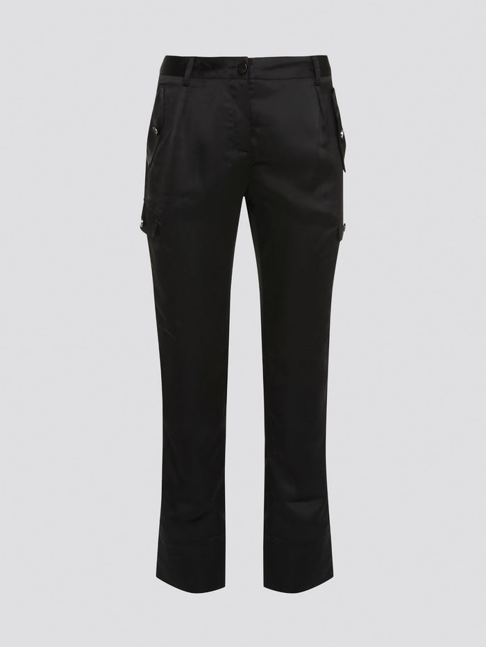 Elevate your everyday look with these sleek and stylish Black Cargo Pants from Roberto Cavalli. Made with premium quality materials, these pants are not only comfortable but also durable for long-lasting wear. With their trendy cargo pockets and tapered fit, they are the perfect statement piece for any fashion-forward individual.