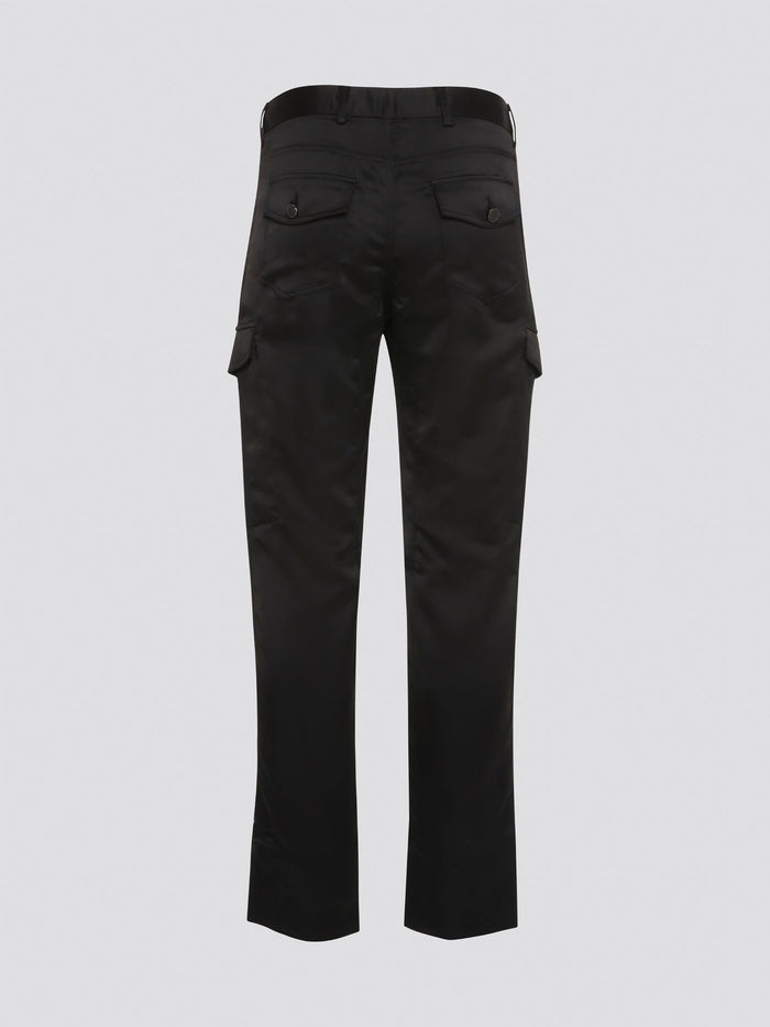 Elevate your everyday look with these sleek and stylish Black Cargo Pants from Roberto Cavalli. Made with premium quality materials, these pants are not only comfortable but also durable for long-lasting wear. With their trendy cargo pockets and tapered fit, they are the perfect statement piece for any fashion-forward individual.