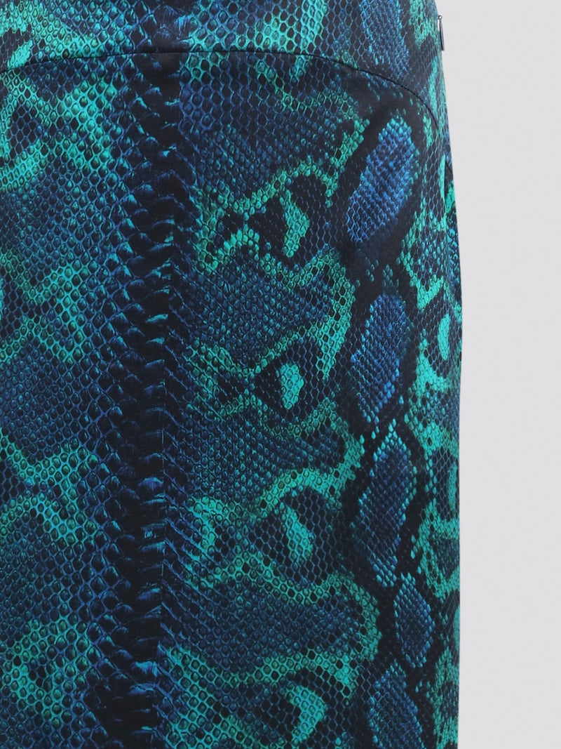 Feel like a fierce fashionista in this stunning Snake Print Maxi Skirt by Roberto Cavalli. With its bold and eye-catching print, this skirt is guaranteed to turn heads wherever you go. Perfect for day or night, this skirt will elevate any outfit and make you feel like a runway star.