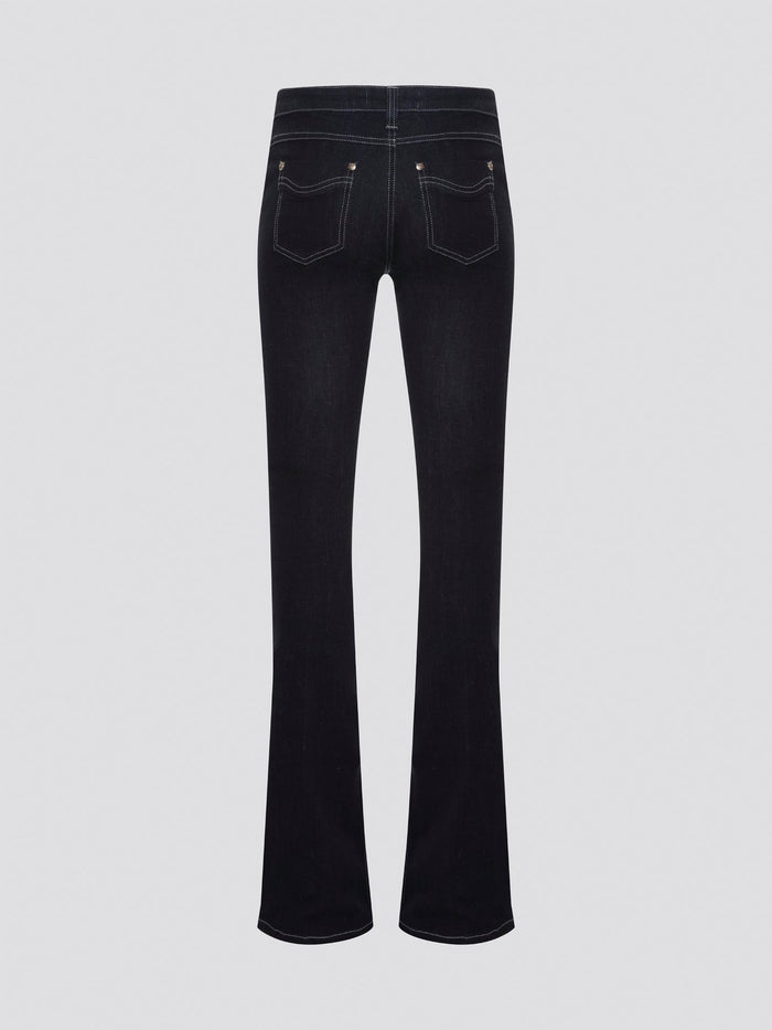 Step out in style with these Roberto Cavalli Black Contrast Stitch Flared Jeans, a modern twist on a classic silhouette. The contrast stitching adds a touch of edge to these sleek black jeans, making them a wardrobe staple for any fashion-forward individual. Pair them with a simple white t-shirt and heels for a chic and sophisticated look that will turn heads wherever you go.