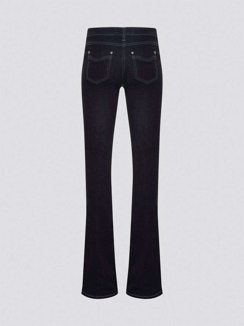 Step out in style with these Roberto Cavalli Black Contrast Stitch Flared Jeans, a modern twist on a classic silhouette. The contrast stitching adds a touch of edge to these sleek black jeans, making them a wardrobe staple for any fashion-forward individual. Pair them with a simple white t-shirt and heels for a chic and sophisticated look that will turn heads wherever you go.