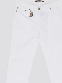 Indulge in timeless elegance and modern sophistication with these White Straight Leg Jeans by Roberto Cavalli. Crafted with precision and attention to detail, these jeans feature a sleek silhouette that effortlessly complements any ensemble. Elevate your everyday wardrobe with a touch of luxury and style with these iconic Roberto Cavalli jeans.