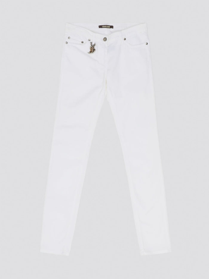 Indulge in timeless elegance and modern sophistication with these White Straight Leg Jeans by Roberto Cavalli. Crafted with precision and attention to detail, these jeans feature a sleek silhouette that effortlessly complements any ensemble. Elevate your everyday wardrobe with a touch of luxury and style with these iconic Roberto Cavalli jeans.