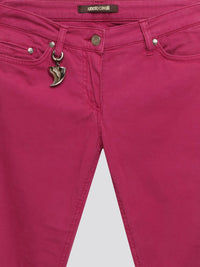 Step out in style with these Pink Skinny Denim Jeans from Roberto Cavalli, the epitome of high fashion and luxury. Crafted with precision and attention to detail, the vibrant pink color adds a fun and feminine touch to your wardrobe. Whether you dress them up or down, these jeans are sure to make a statement wherever you go.