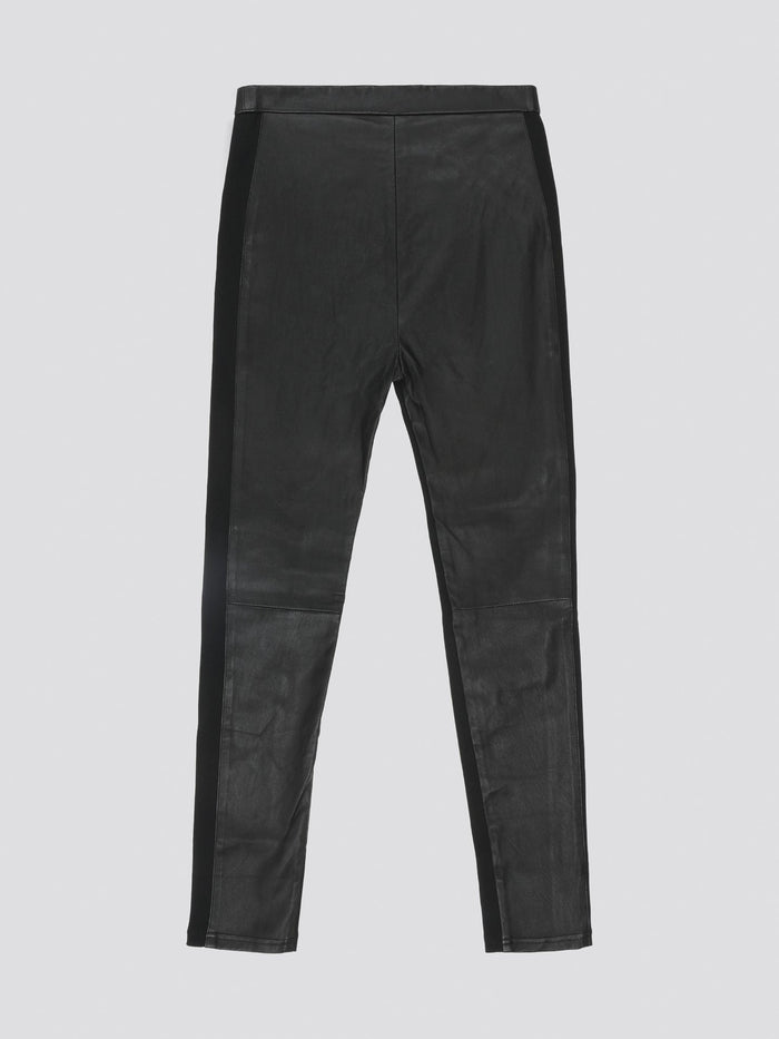 Step out in style and confidence with these Black Slim Fit Leather Pants from Roberto Cavalli. Crafted from buttery soft leather, these pants hug your curves in all the right places for a sleek and sexy silhouette. Whether you're heading out for a night on the town or simply want to elevate your everyday look, these pants are sure to make a bold statement.