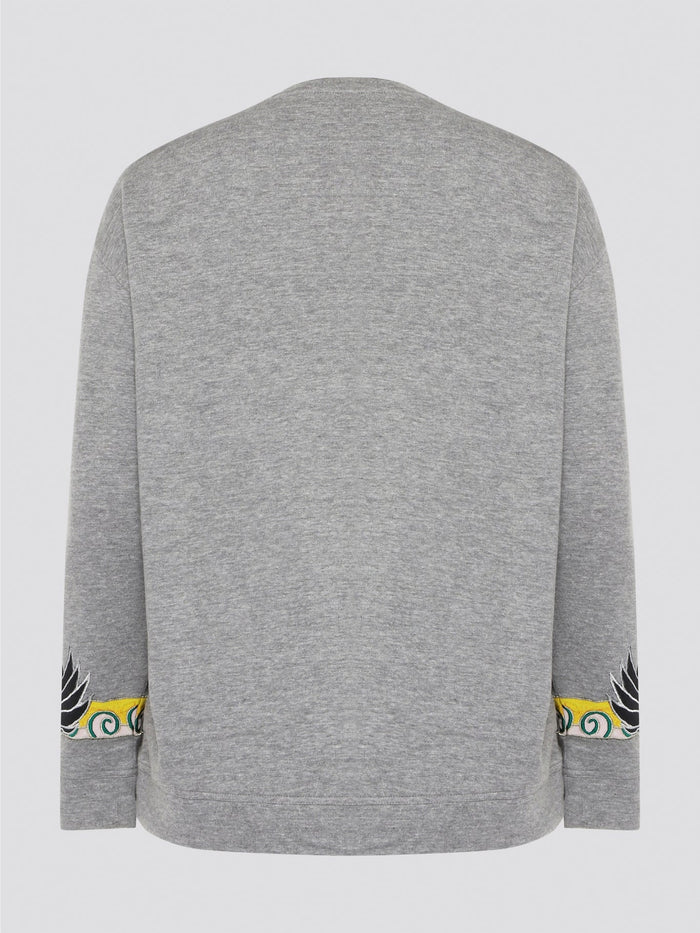 Elevate your casual wardrobe with this effortlessly chic Grey Embroidered Sweatshirt from Roberto Cavalli. Crafted with intricate floral embroidery, this sweatshirt adds a touch of luxury to your everyday look. Pair it with jeans for a stylish and comfortable outfit that will turn heads wherever you go.