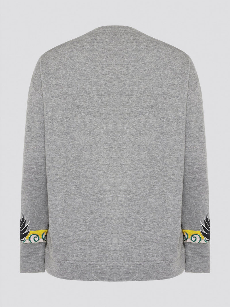 Elevate your casual wardrobe with this effortlessly chic Grey Embroidered Sweatshirt from Roberto Cavalli. Crafted with intricate floral embroidery, this sweatshirt adds a touch of luxury to your everyday look. Pair it with jeans for a stylish and comfortable outfit that will turn heads wherever you go.