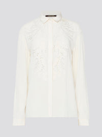 Feel like a bohemian queen in this exquisite white embroidered long sleeve blouse from Roberto Cavalli. The intricate detailing and luxurious fabric create a stunning and timeless piece that is perfect for any occasion. Elevate your wardrobe and make a statement with this elegant and unique blouse.